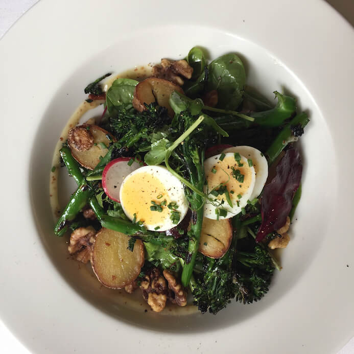 A beautiful plate of New season broccoli and fingerling potato salad, red onion, hard boiled egg, walnuts and honey and Dijon dressing from Fallon & Byrne in Dublin. Not a trace of cheese in sight.