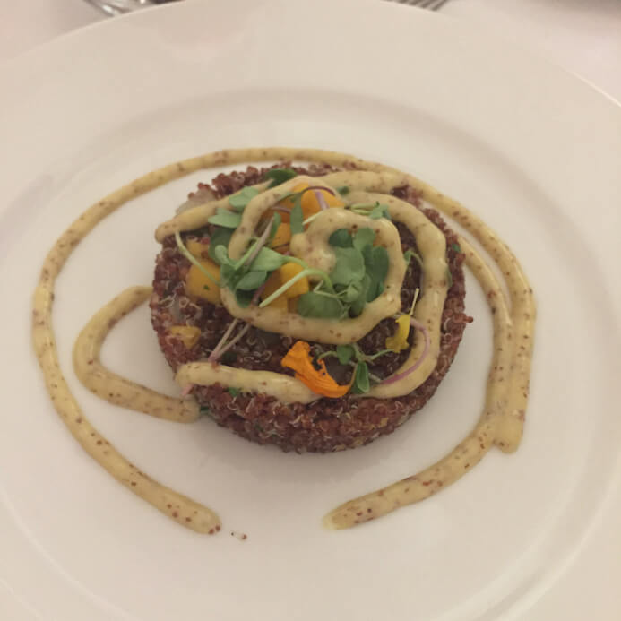 A plate of protein packed red quinoa salad with fresh mango from hotel Castilla Termal Monastery of Valbuena in Spain