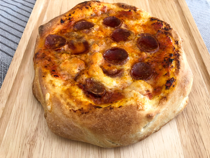 Thick crust pizza with chorizo