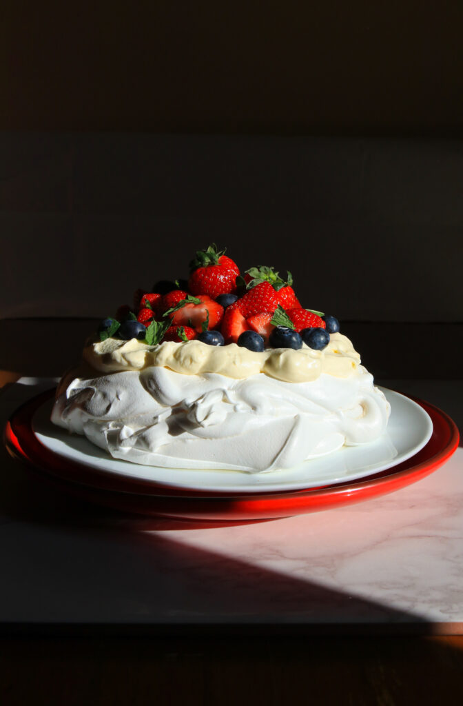 Summer berry pavlova recipe and food photography by Melanie May